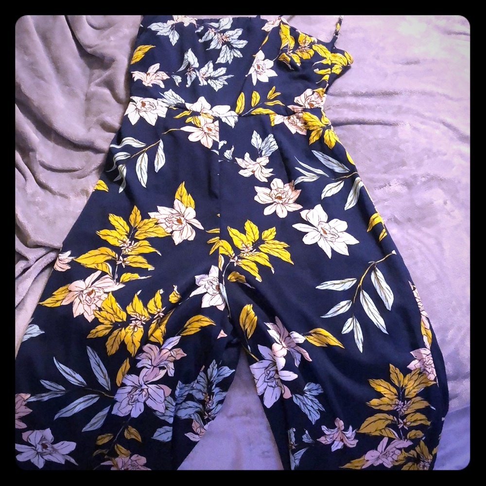 Wide leg jumpsuit with back out .